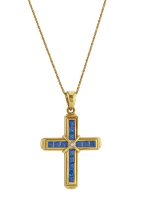 Lot 411 - An 18ct gold calibre-cut sapphire cross...