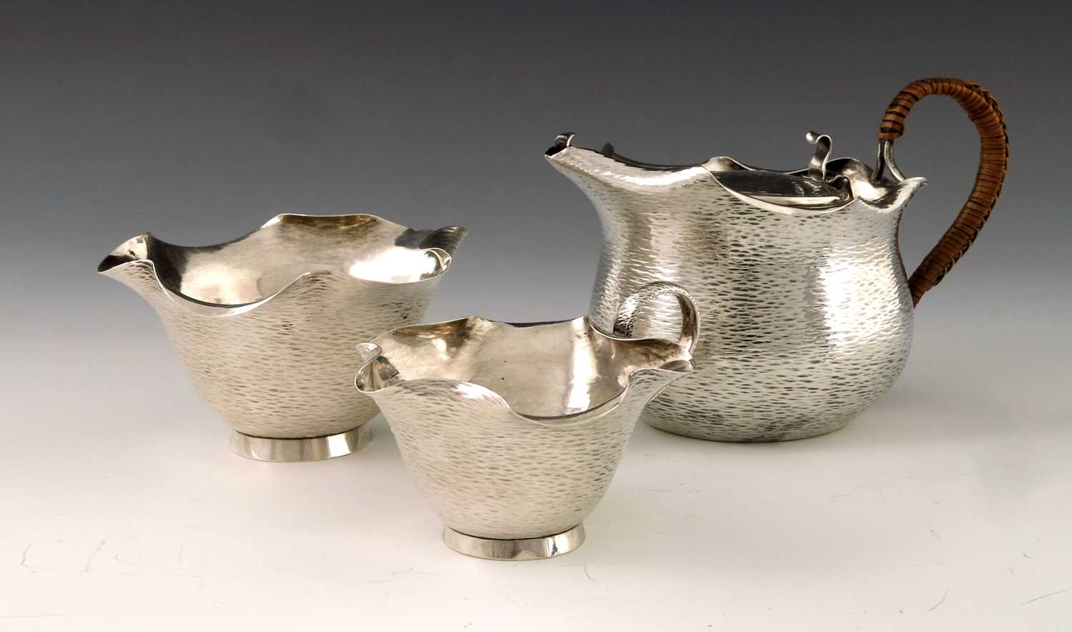 Lot 153 - A Victorian Aesthetic Movement silver tea set,...