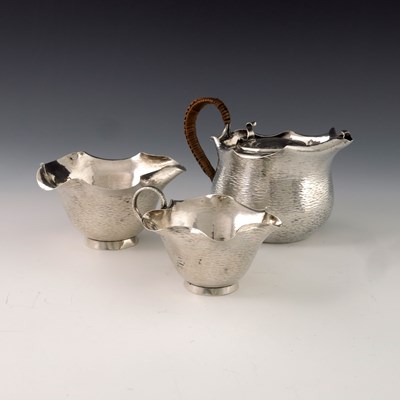 Lot 153 - A Victorian Aesthetic Movement silver tea set,...
