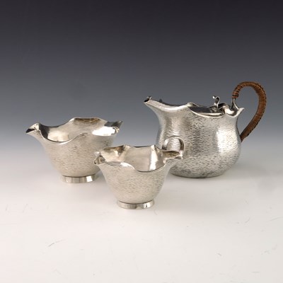 Lot 153 - A Victorian Aesthetic Movement silver tea set,...