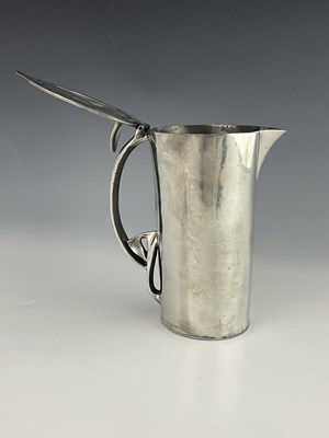 Lot 132 - Archibald Knox for Liberty and Co., a Tudric Arts and Crafts pewter lidded jug