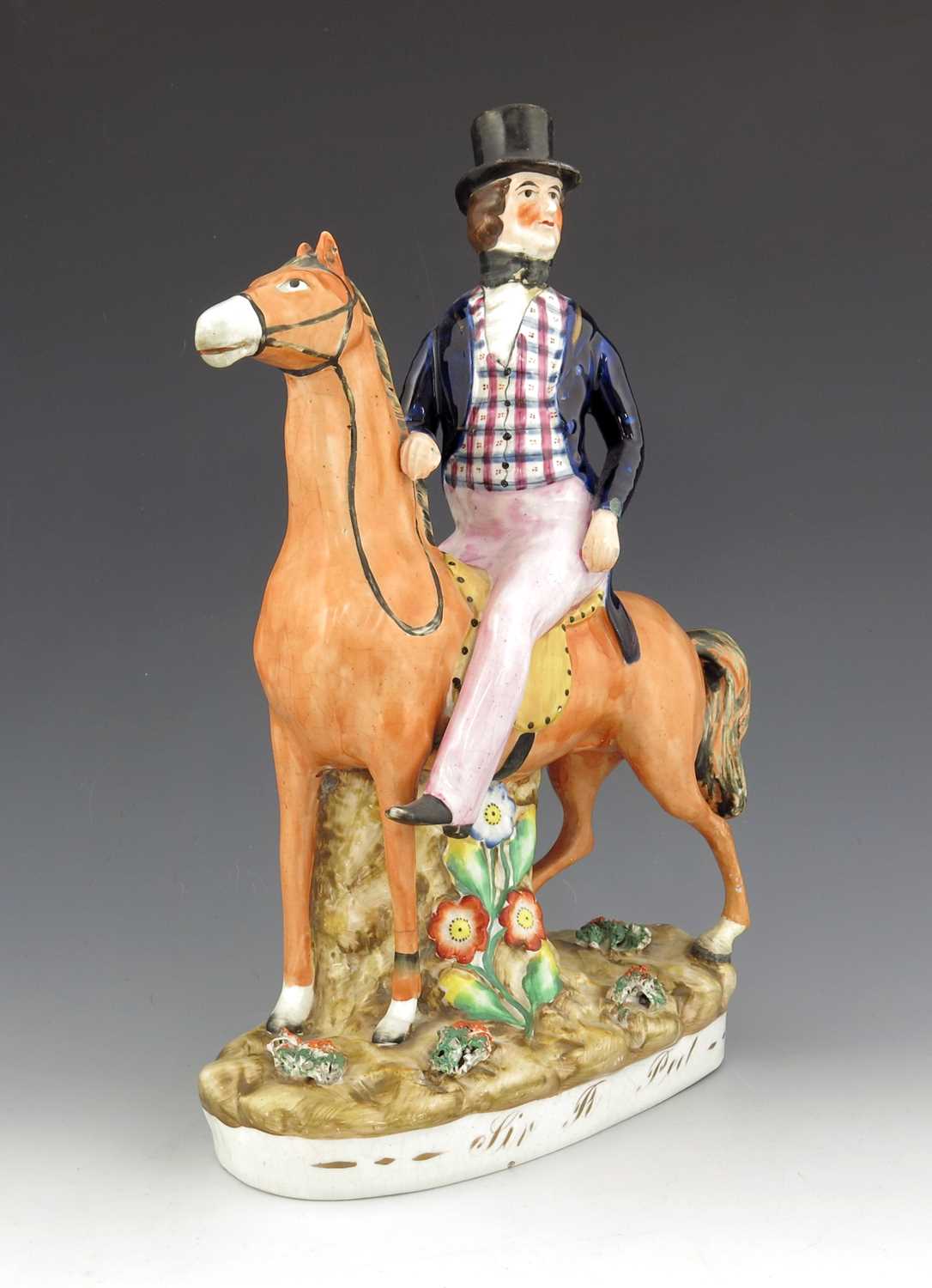 Lot 1020 - A Staffordshire figure of Robert Peel, titled '...