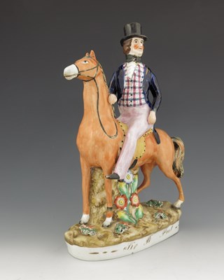 Lot 1020 - A Staffordshire figure of Robert Peel, titled '...