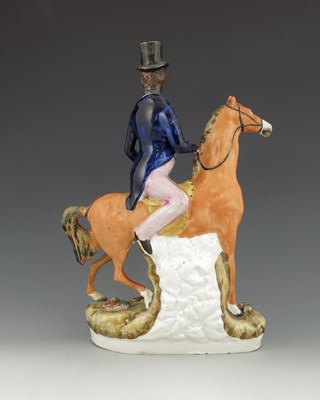 Lot 1020 - A Staffordshire figure of Robert Peel, titled '...