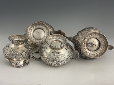 Lot 46 - A George III/IV silver matched four-piece tea...