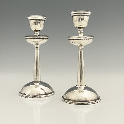 Lot 241 - A pair of George V silver candlesticks, with...