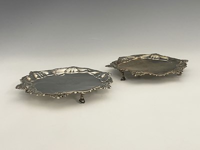 Lot 57 - A pair of George II silver card trays or...