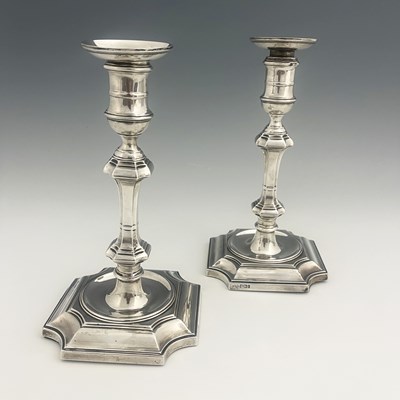 Lot 276 - A pair of Edwardian silver candlesticks,...