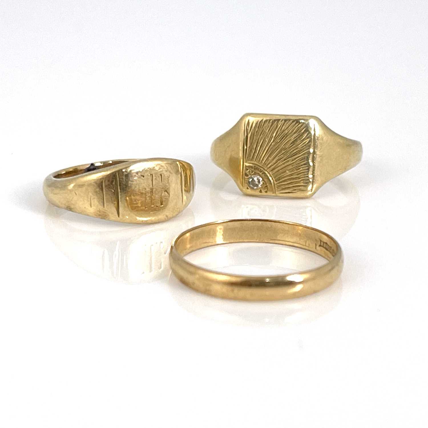 Lot 18 - Three 9 carat gold rings, including wedding...