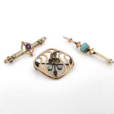 Lot 44 - Three Arts and Crafts gold and gem set...