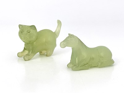 Lot 507 - Two Chinese carved jade figures of a cat and...