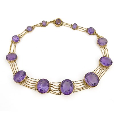 Lot 30 - A Victorian amethyst and yellow metal necklace,...