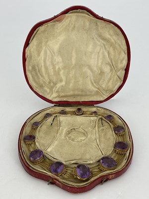 Lot 30 - A Victorian amethyst and yellow metal necklace,...