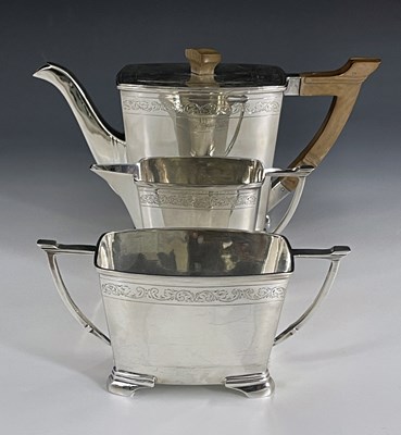 Lot 294 - A George VI silver three-piece tea set, Art...