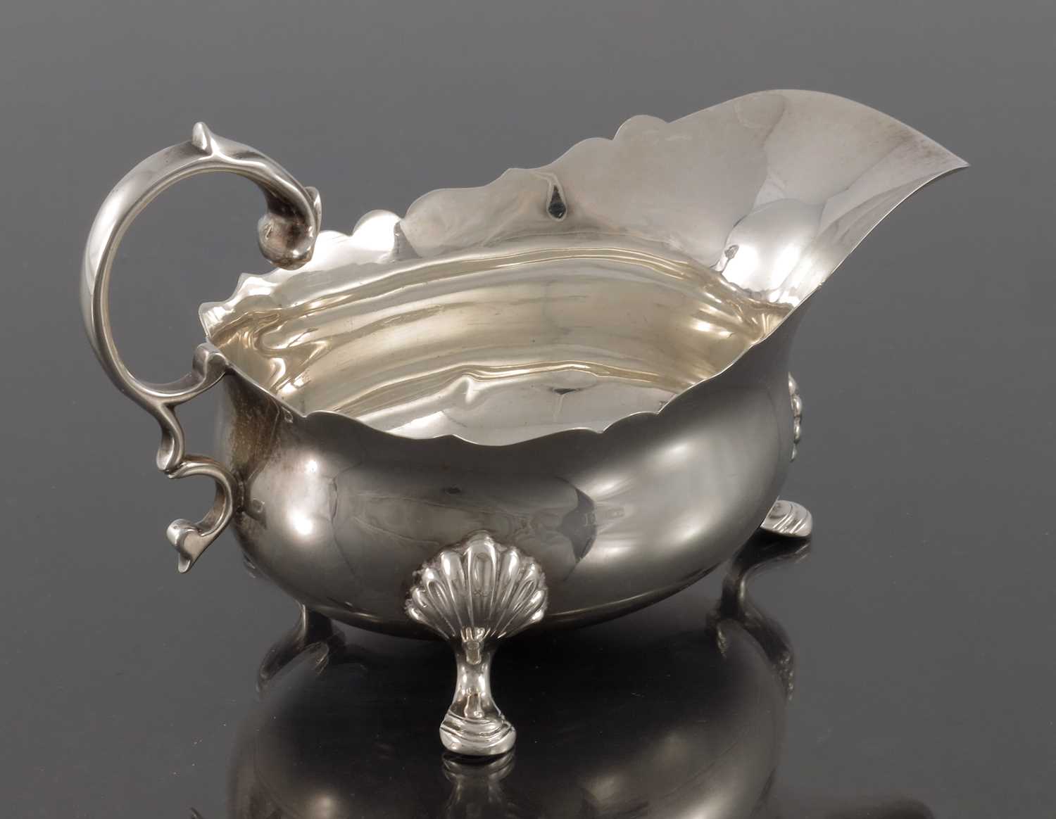 Lot 94 - A George V silver sauce boat, H Pidduck and...