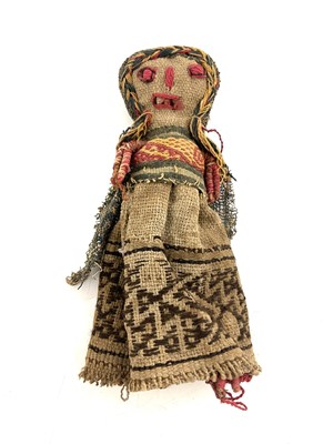 Lot 587 - A Peruvian Cahncay textile burial doll, woman...