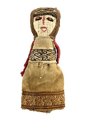 Lot 588 - A Peruvian Chancay textile burial doll, girl...