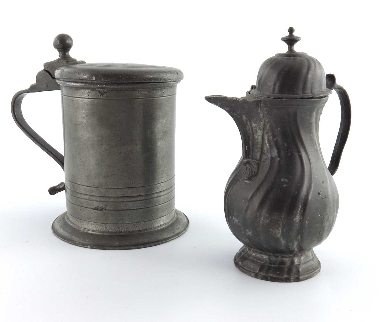 Lot 685 - A large German pewter tankard, dated 1733, and...