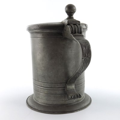 Lot 685 - A large German pewter tankard, dated 1733, and...