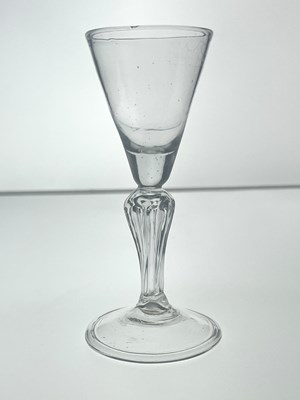 Lot 455 - A Dutch hollow baluster wine glass, circa 1740,...