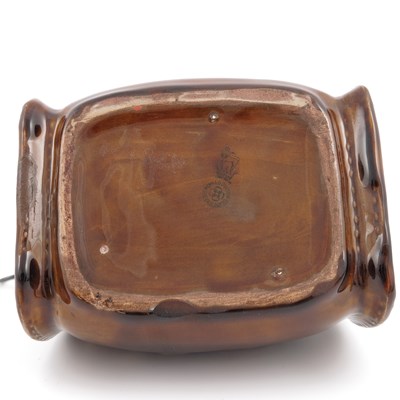 Lot 1085 - A Royal Doulton Kingsware leather bottle...