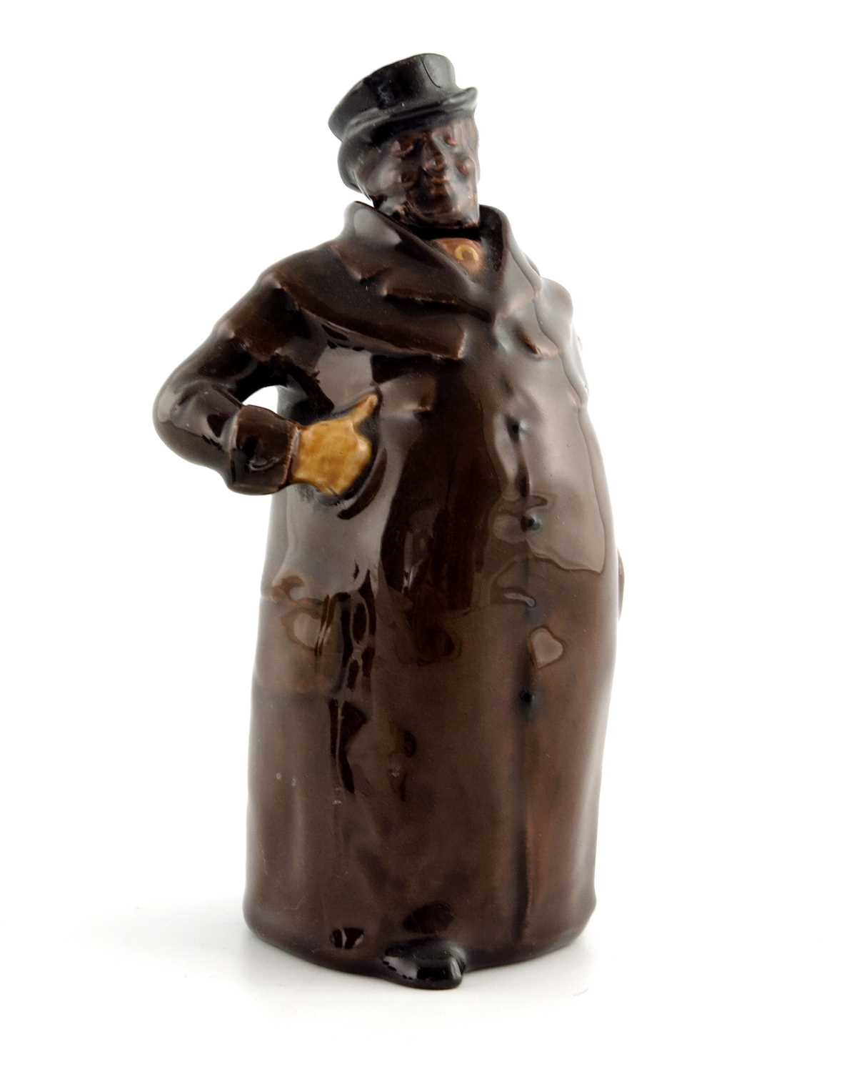 Lot 1101 - A Royal Doulton Kingsware figural whisky jug,...