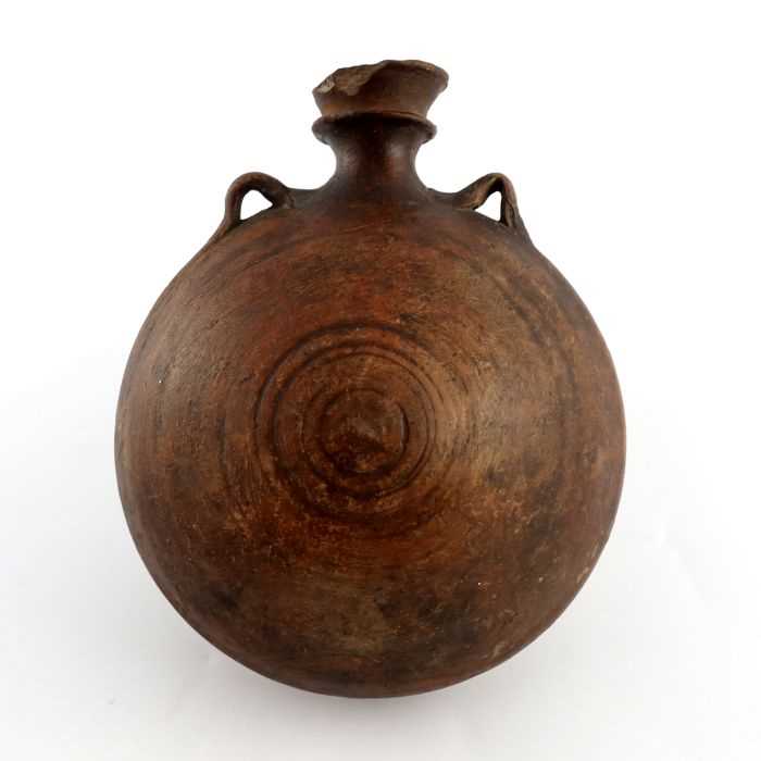 Lot 1118 - A 15th century ceramic costrell, circular with...