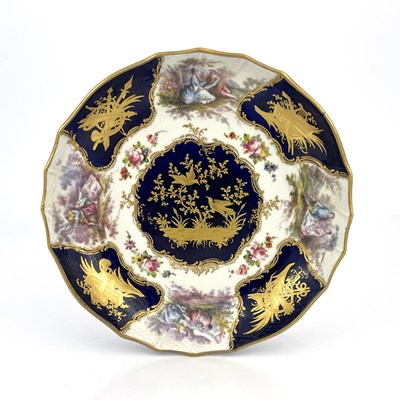 Lot 687 - A 'Sevres' porcelain plate or dish, soft paste...