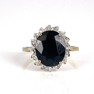 Lot 25 - A 9ct gold, sapphire and diamond ring, ring...