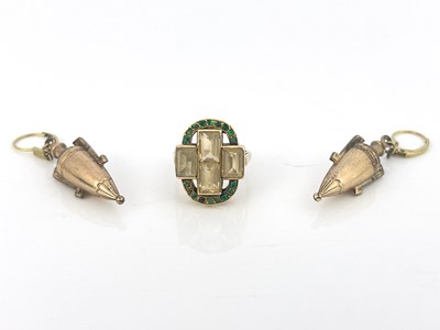 Lot 37 - A yellow gold four-stone topaz ring with an...