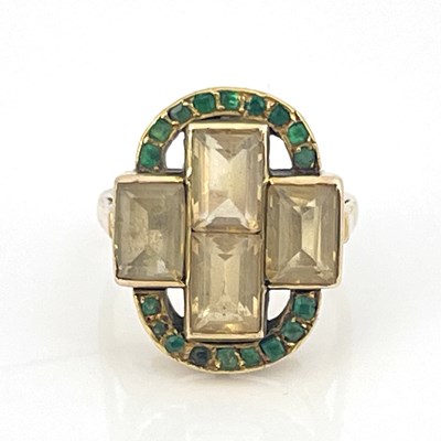 Lot 37 - A yellow gold four-stone topaz ring with an...