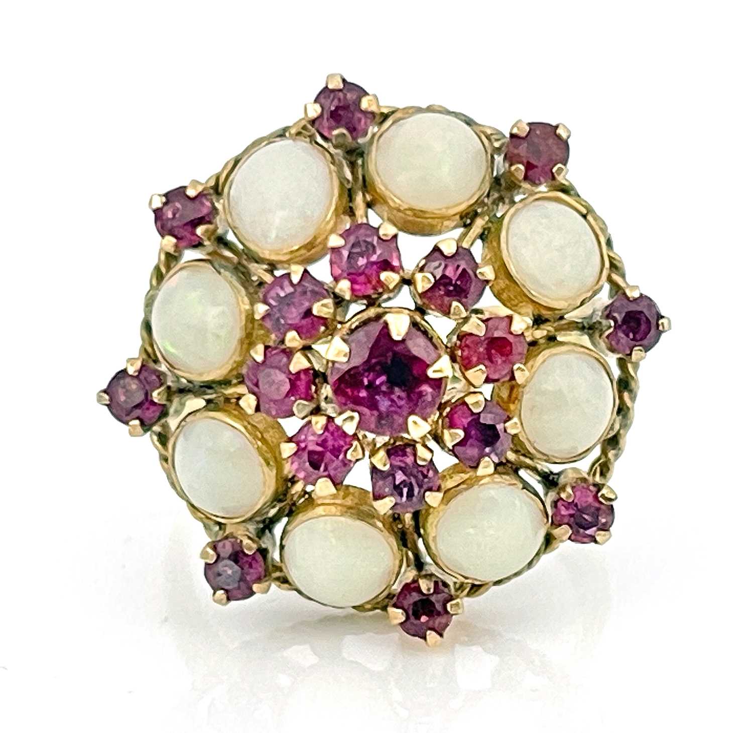 Lot 6 - An 18k gold opal and ruby cluster ring, ring...