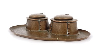 Lot 154 - An Arts and Crafts copper double inkwell, bark...