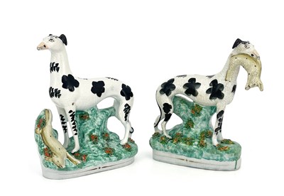 Lot 852 - A pair of Staffordshire figures of greyhounds,...