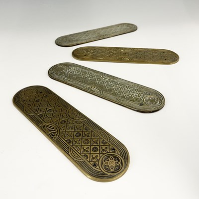 Lot 136 - A set of four Aesthetic Movement gilt brass...