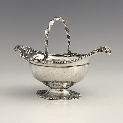 Lot 310 - A George II Rococo silver basket, the ogee...