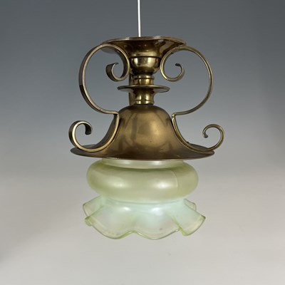 Lot 169 - An Arts and Crafts brass and opalescent glass...