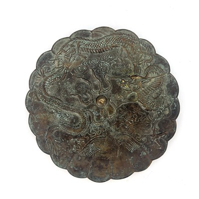 Lot 511 - A Chinese bronze plate, scalloped rim, cast in...