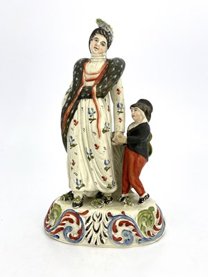 Lot 824 - A Staffordshire pottery pearlware figure,...