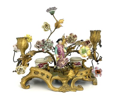 Lot 682 - A German porcelain and ormolu mounted florally...