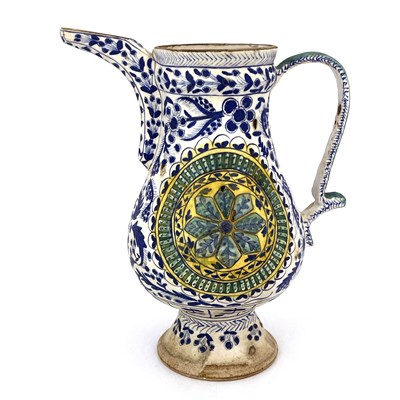 Lot 569 - A Turkish Ottoman pottery ewer, footed...