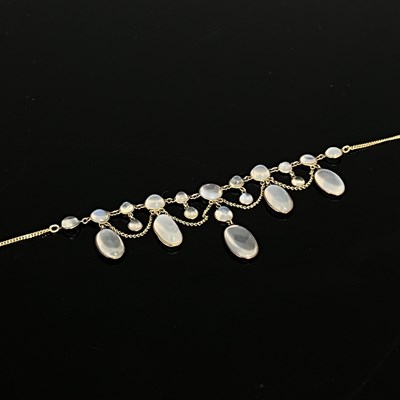 Lot 32 - A late 19th Century gold moonstone fringe...