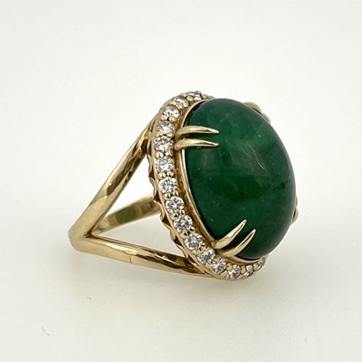 Lot 22 - A large cabochon emerald and diamond cluster...