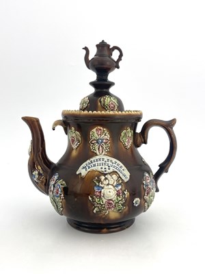 Lot 745 - A large Measham Bargeware teapot, circa 1880,...