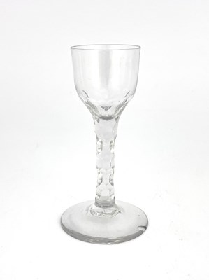 Lot 521 - A facet stem wine glass, circa 1780, the ogee...