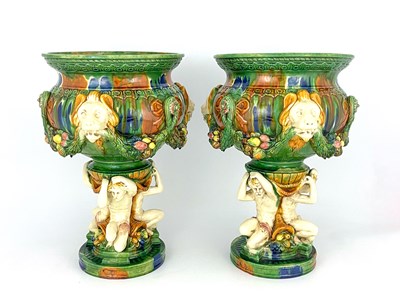 Lot 684 - A pair of majolica glazed jardinieres, lion...