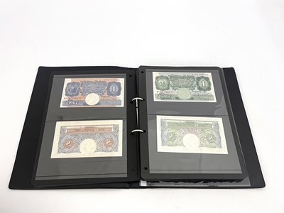 Lot 76 - English Banknotes, a black vinyl album...