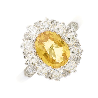 Lot 24 - A platinum yellow sapphire and brilliant-cut...