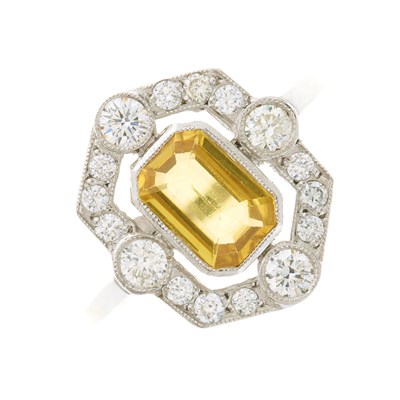 Lot 98 - A platinum yellow sapphire dress ring, with...