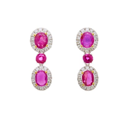 Lot 100 - A pair of 18ct gold oval-shape ruby and...